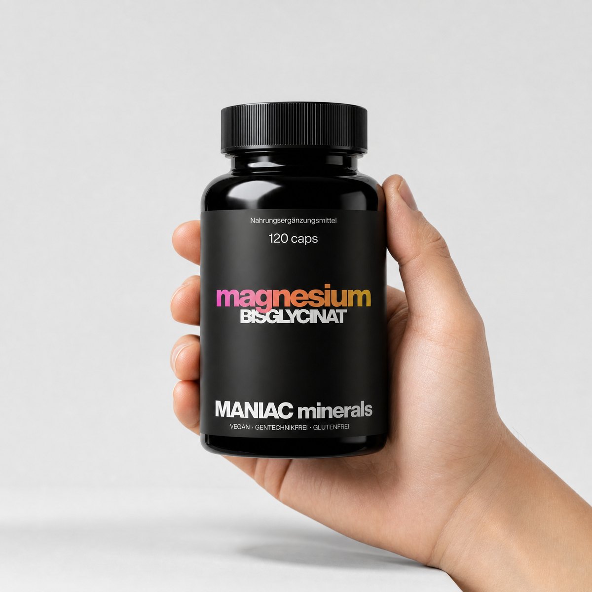 Magnesium Bisglycinat Dose in echter Größe in der Hand